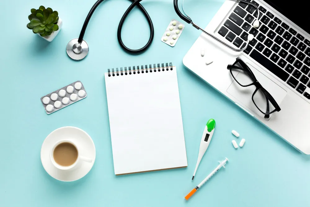 Notebook, pills, tablets, coffee and laptop on table showing safety